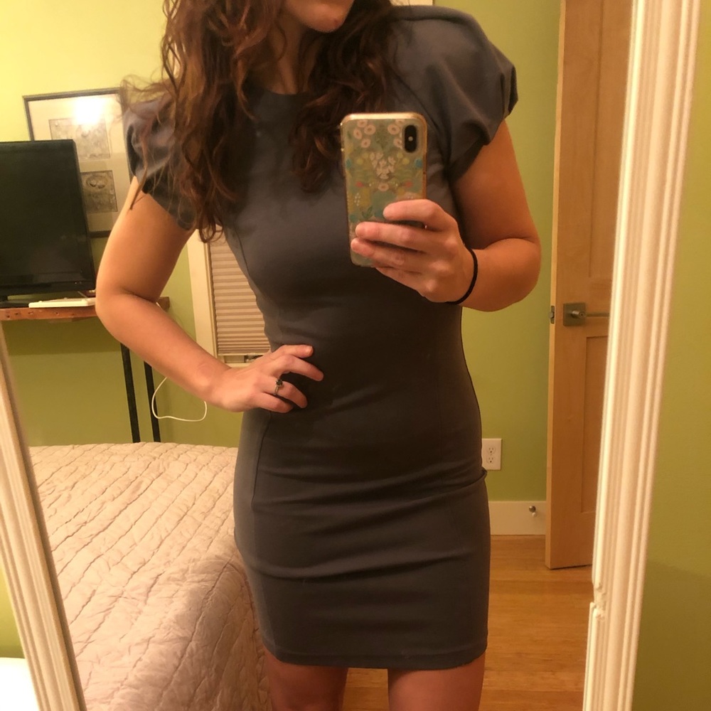 Sisley bodycon dress size XS with puffy sleeves.